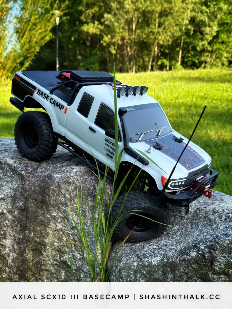 Axial SCX10 III Base Camp RC crawler climbing a rock